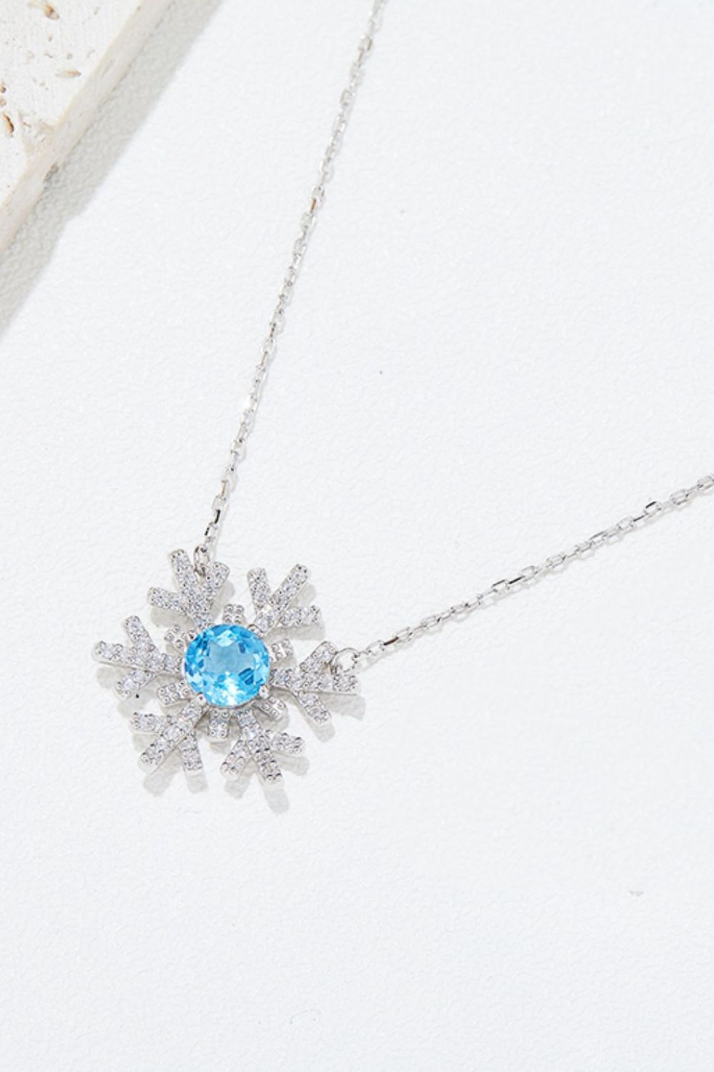 Winter Radiance Topaz Snowflake Necklace