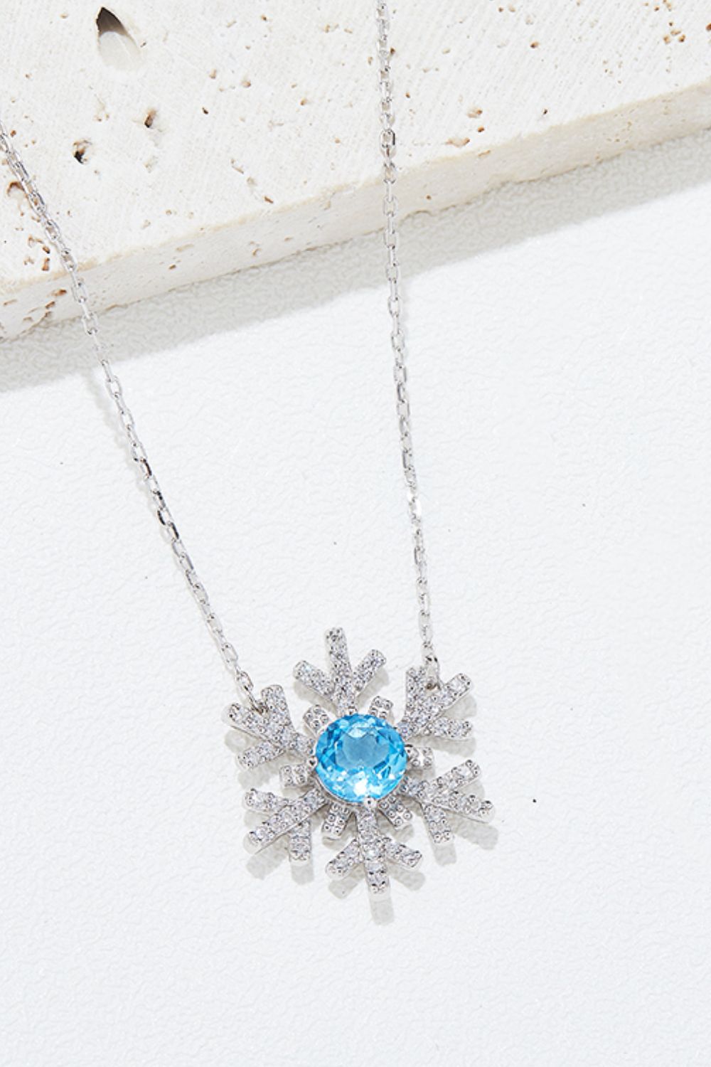 Winter Radiance Topaz Snowflake Necklace
